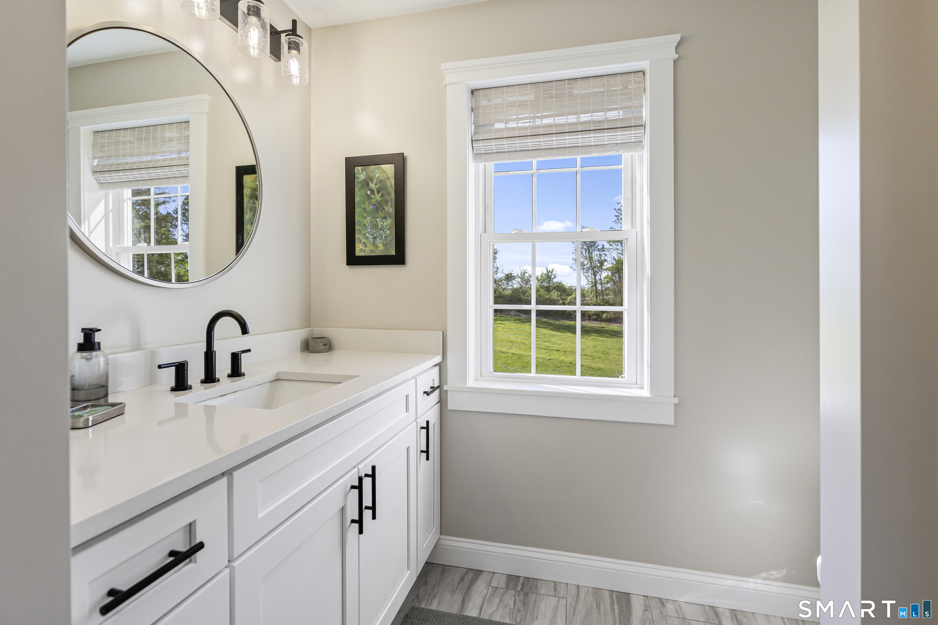 29 Beecher Road Brooklyn, CT 06234 - Photo 34 of 40 a bathroom with a double vanity sink and a window