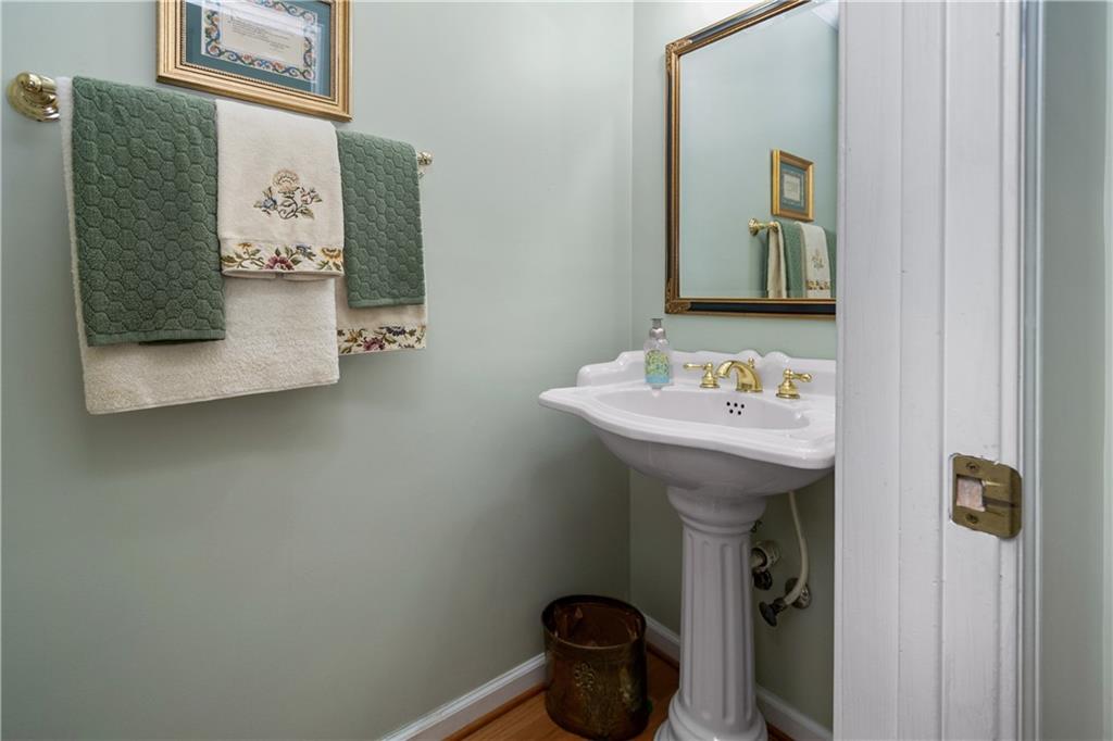 405 Ridgemont Drive Fayetteville, GA 30215 - Photo 16 of 43 a bathroom with a sink and a mirror