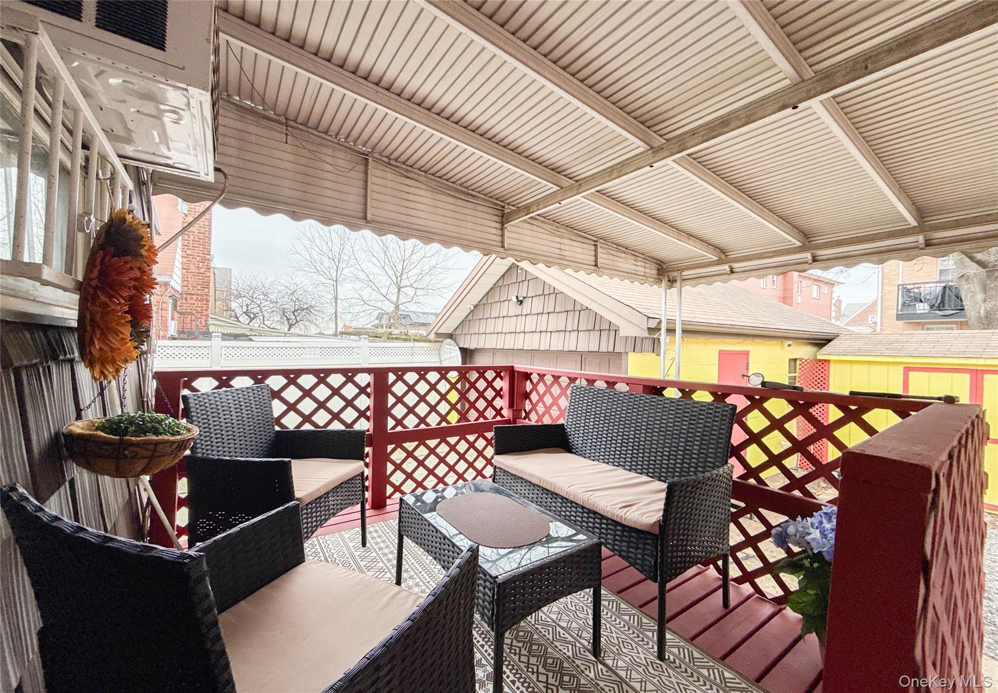 134-37 58th Road Queens, NY 11355 - Photo 12 of 24 Wooden deck featuring an outdoor living space