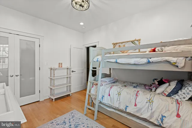 a bedroom with a bed and closet