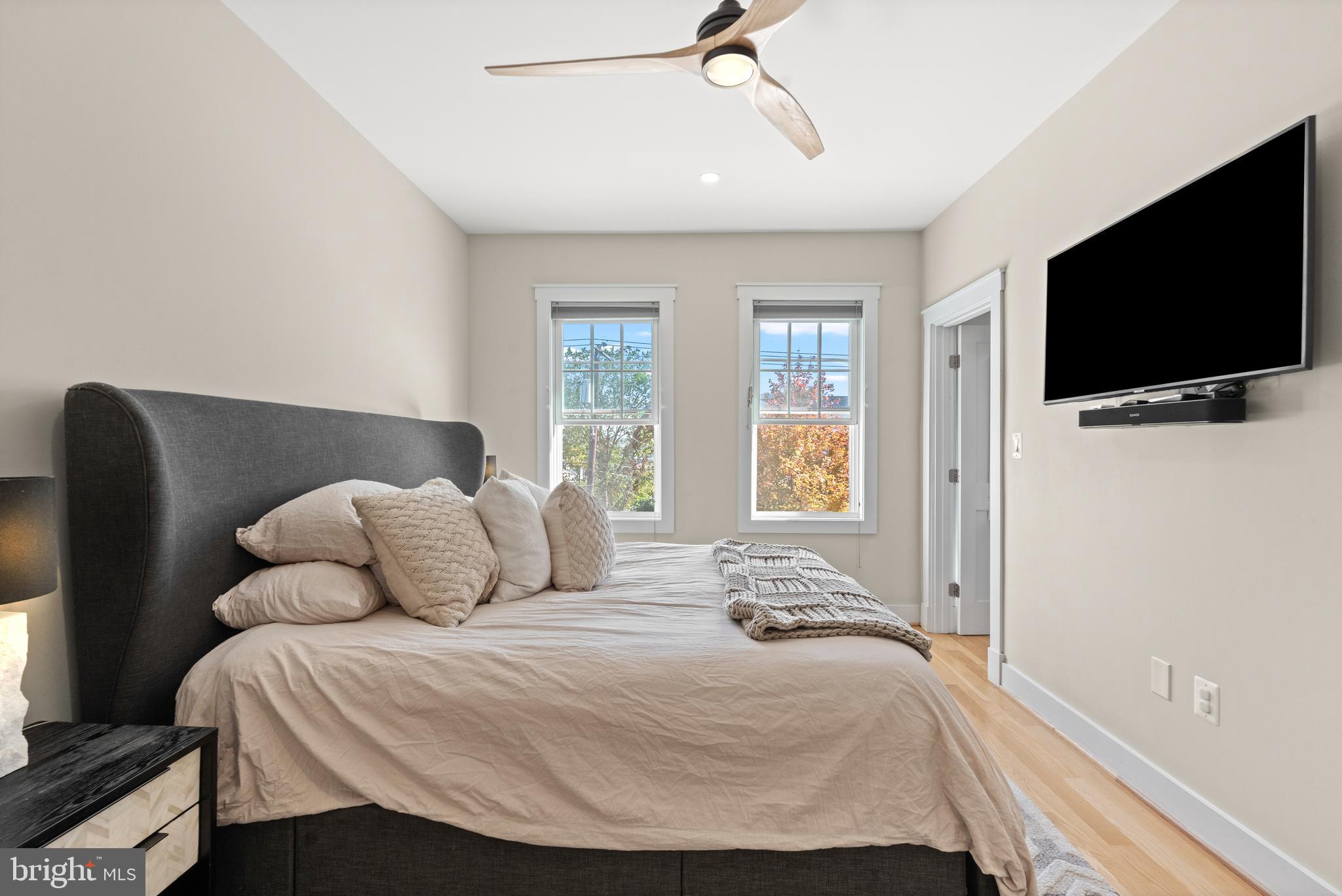4718 15th Street Northwest Washington, DC 20011 - Photo 28 of 49 a bedroom with a bed and a flat screen tv