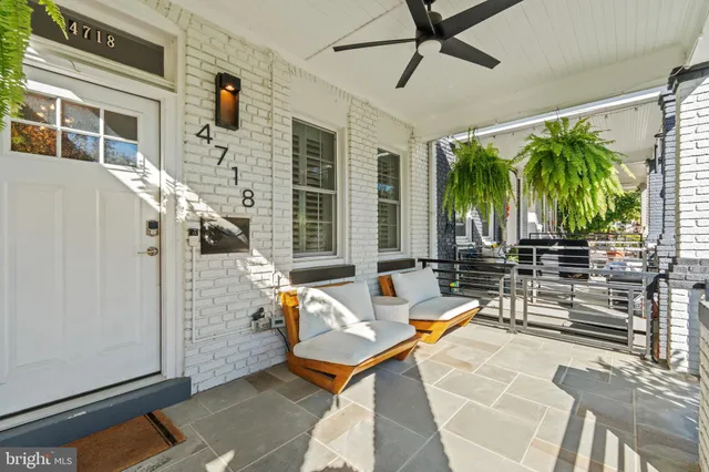 a view of a patio with a table and chairs