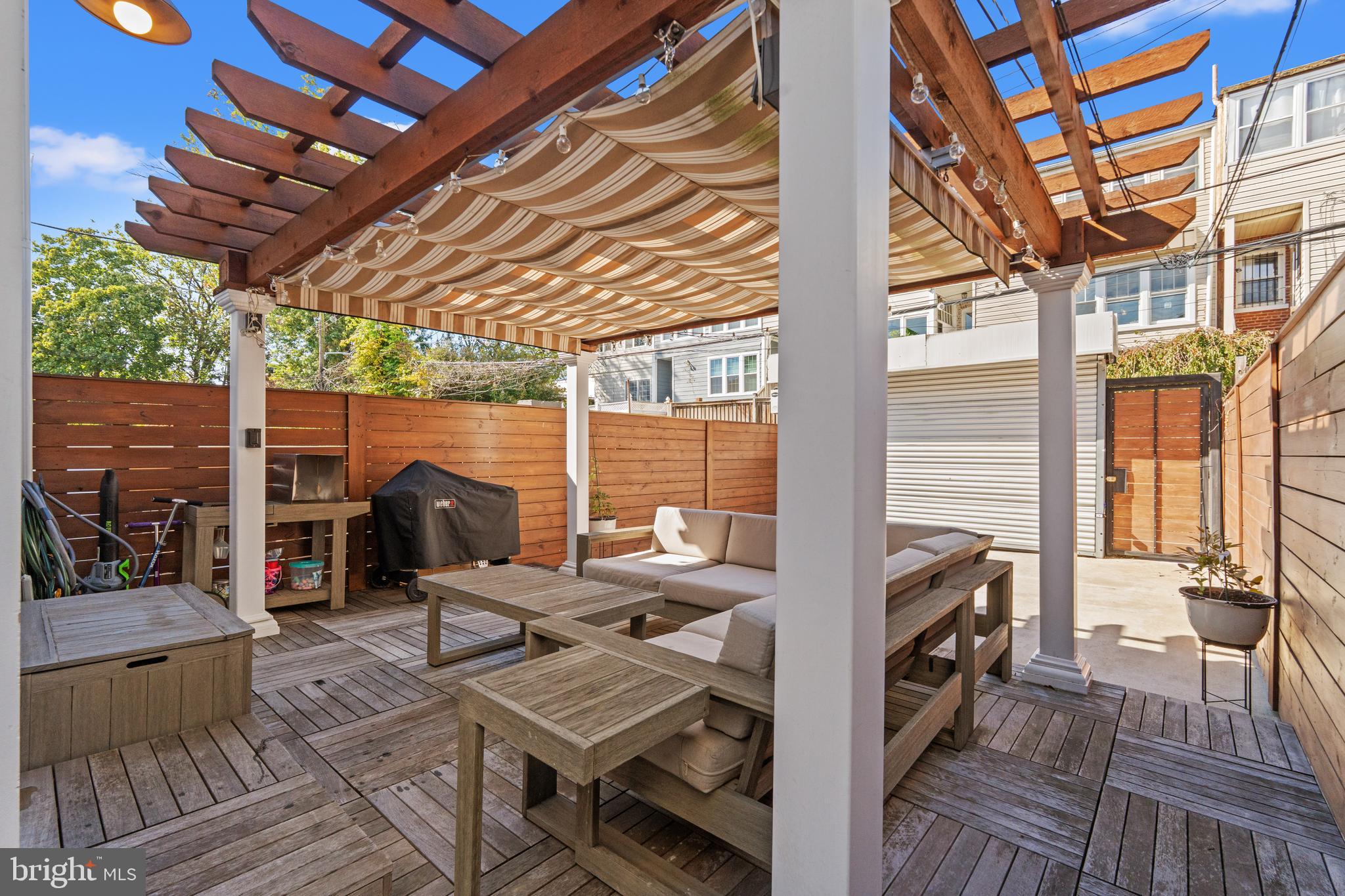 4718 15th Street Northwest Washington, DC 20011 - Photo 44 of 49 a view of a patio with table and chairs and wooden floor