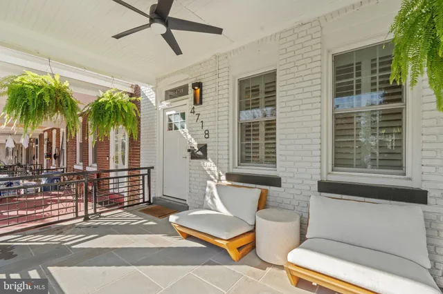 a view of a patio with couches and potted plants