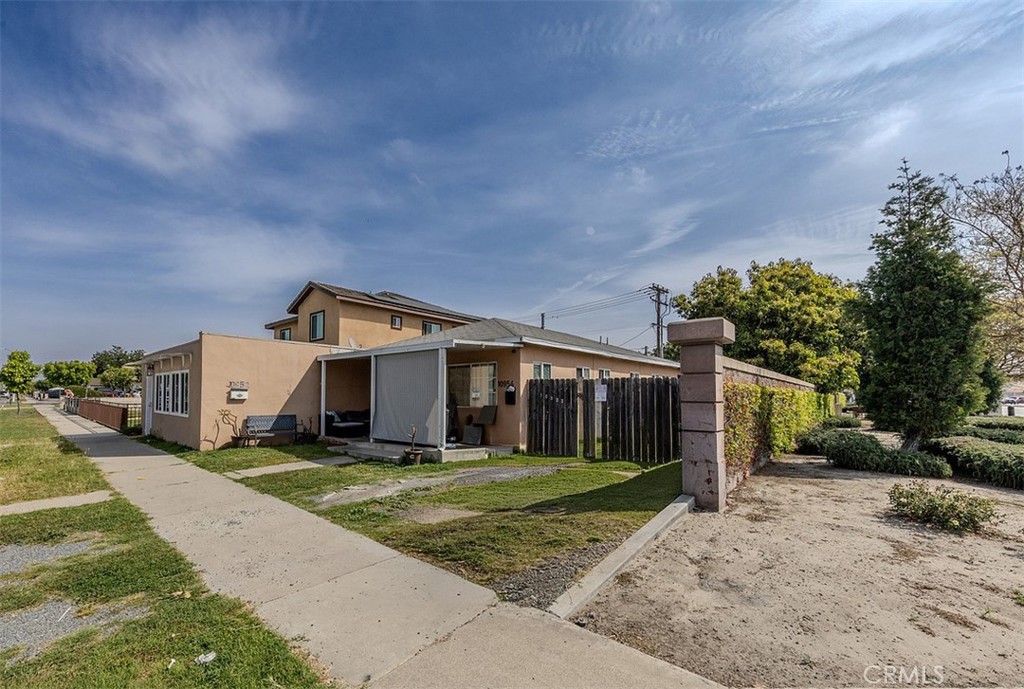 10952 Rose Street Stanton, CA 90680 - Photo 28 of 34 a front view of a house with a yard and trees