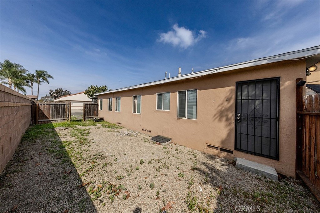 10952 Rose Street Stanton, CA 90680 - Photo 31 of 34 a view of a house with a wooden fence