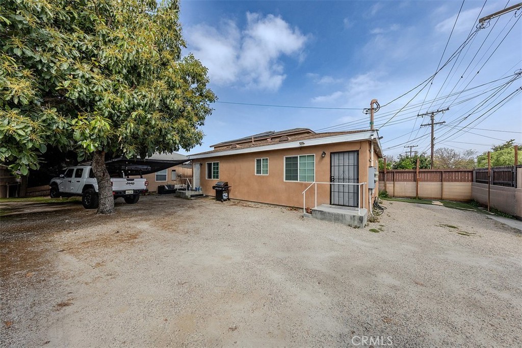 10952 Rose Street Stanton, CA 90680 - Photo 33 of 34 a view of a house with a large tree
