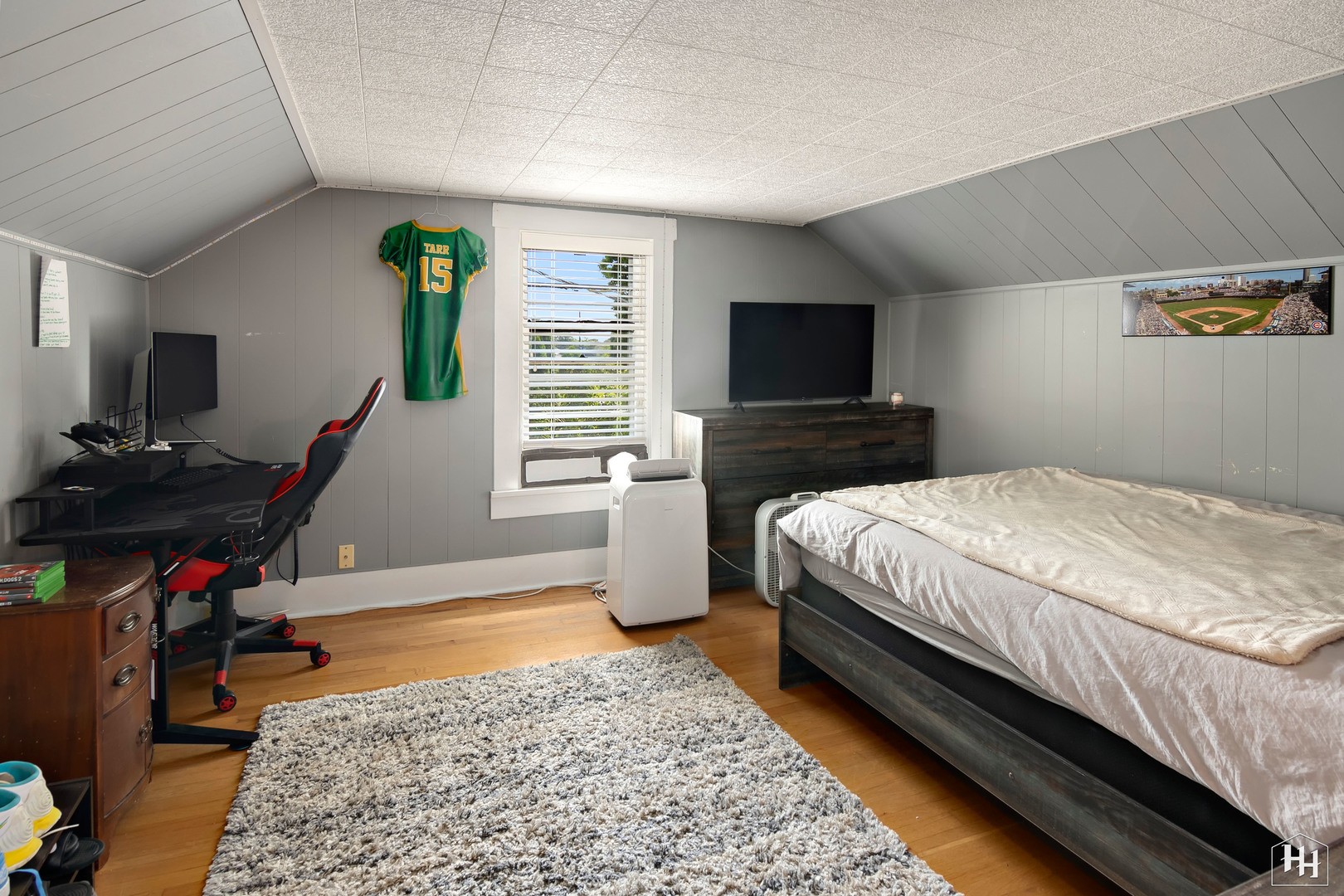 2761 Prairie Road Buffalo Grove, IL 60089 - Photo 15 of 23 a bedroom with a bed a flat screen tv and windows