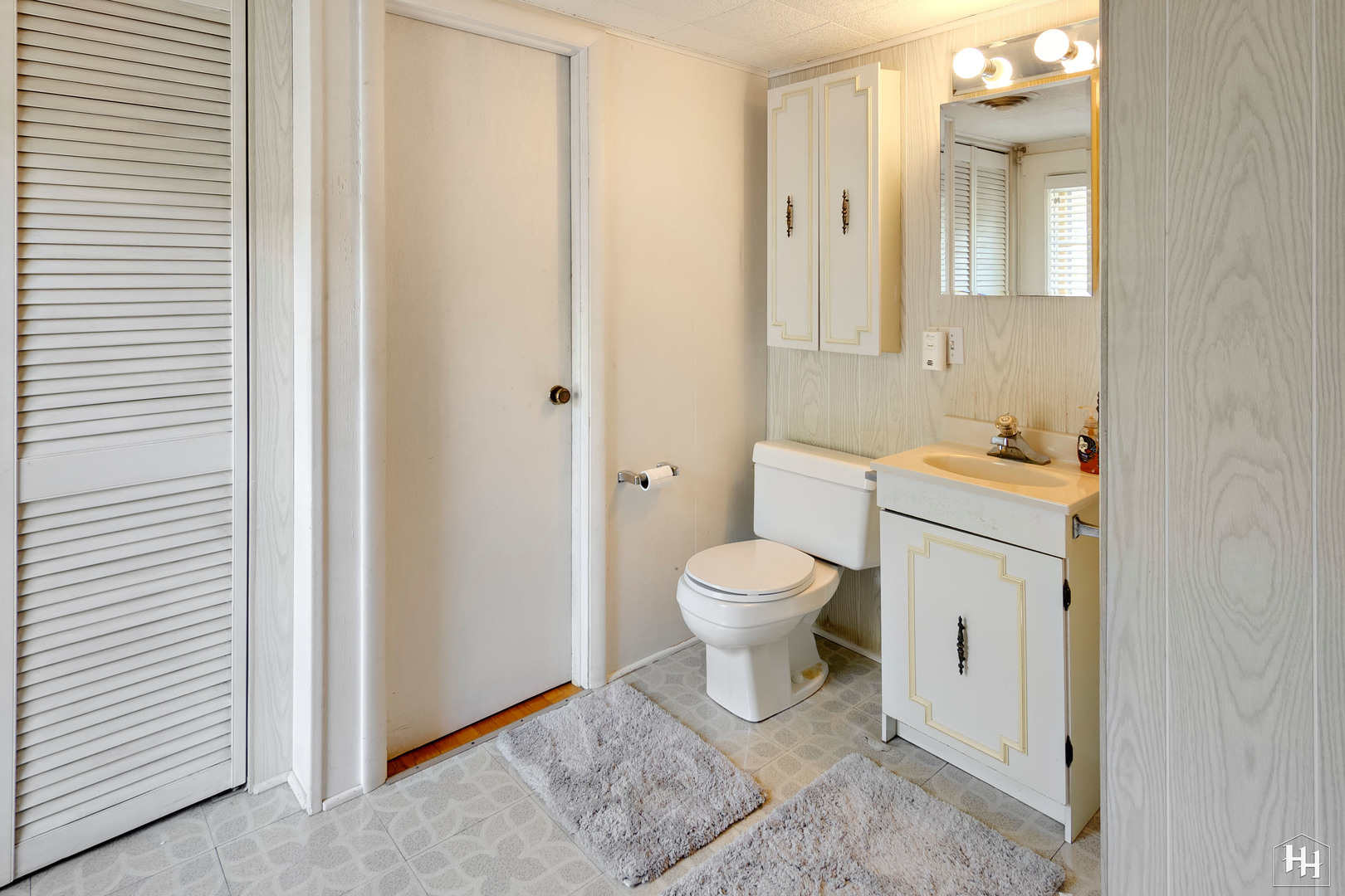 2761 Prairie Road Buffalo Grove, IL 60089 - Photo 17 of 23 a white toilet sitting next to a bathroom sink