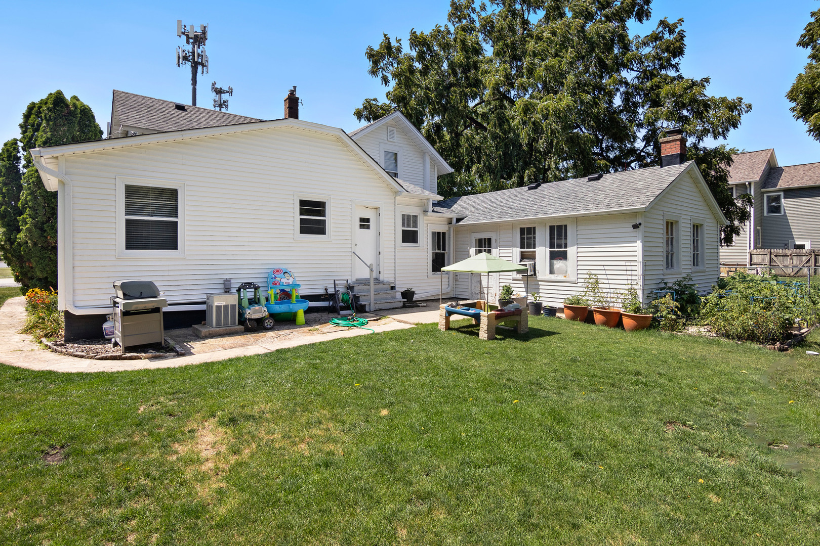 2761 Prairie Road Buffalo Grove, IL 60089 - Photo 20 of 23 a view of a house with backyard sitting area and garden