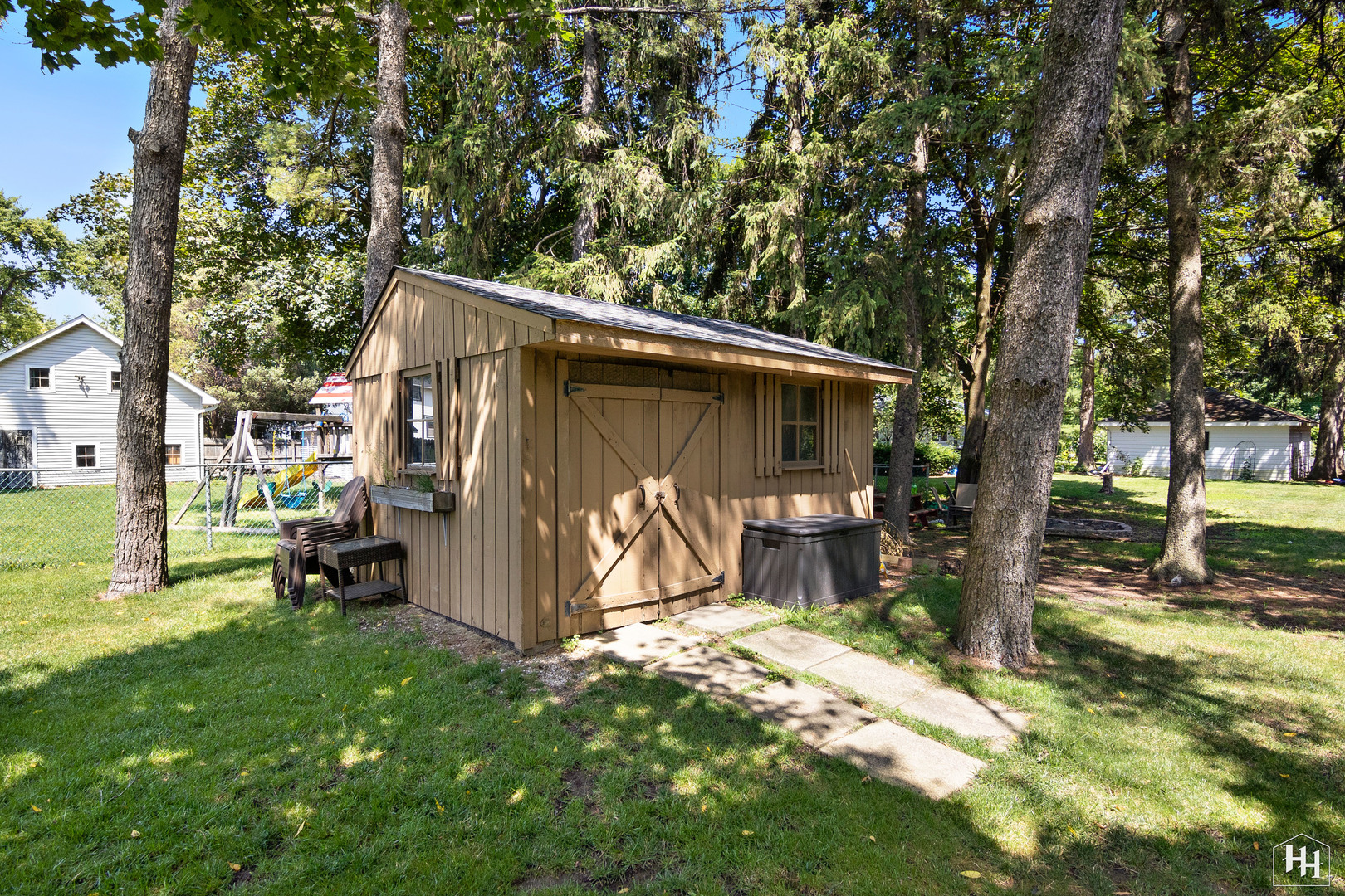 2761 Prairie Road Buffalo Grove, IL 60089 - Photo 23 of 23 a view of backyard with wooden fence and a large tree