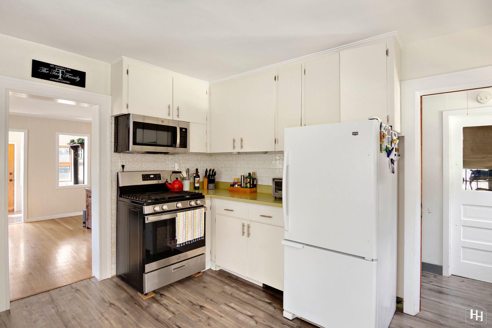 2761 Prairie Road Buffalo Grove, IL 60089 - Photo 5 of 23 a white refrigerator freezer and a stove sitting inside of a kitchen