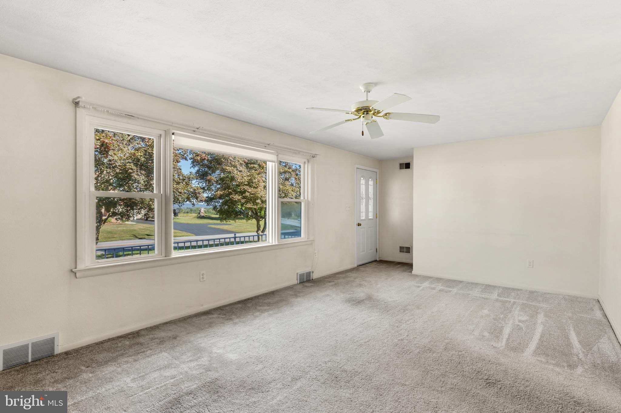 1640 Church Road York, PA 17408 - Photo 4 of 26 an empty room with windows and fan