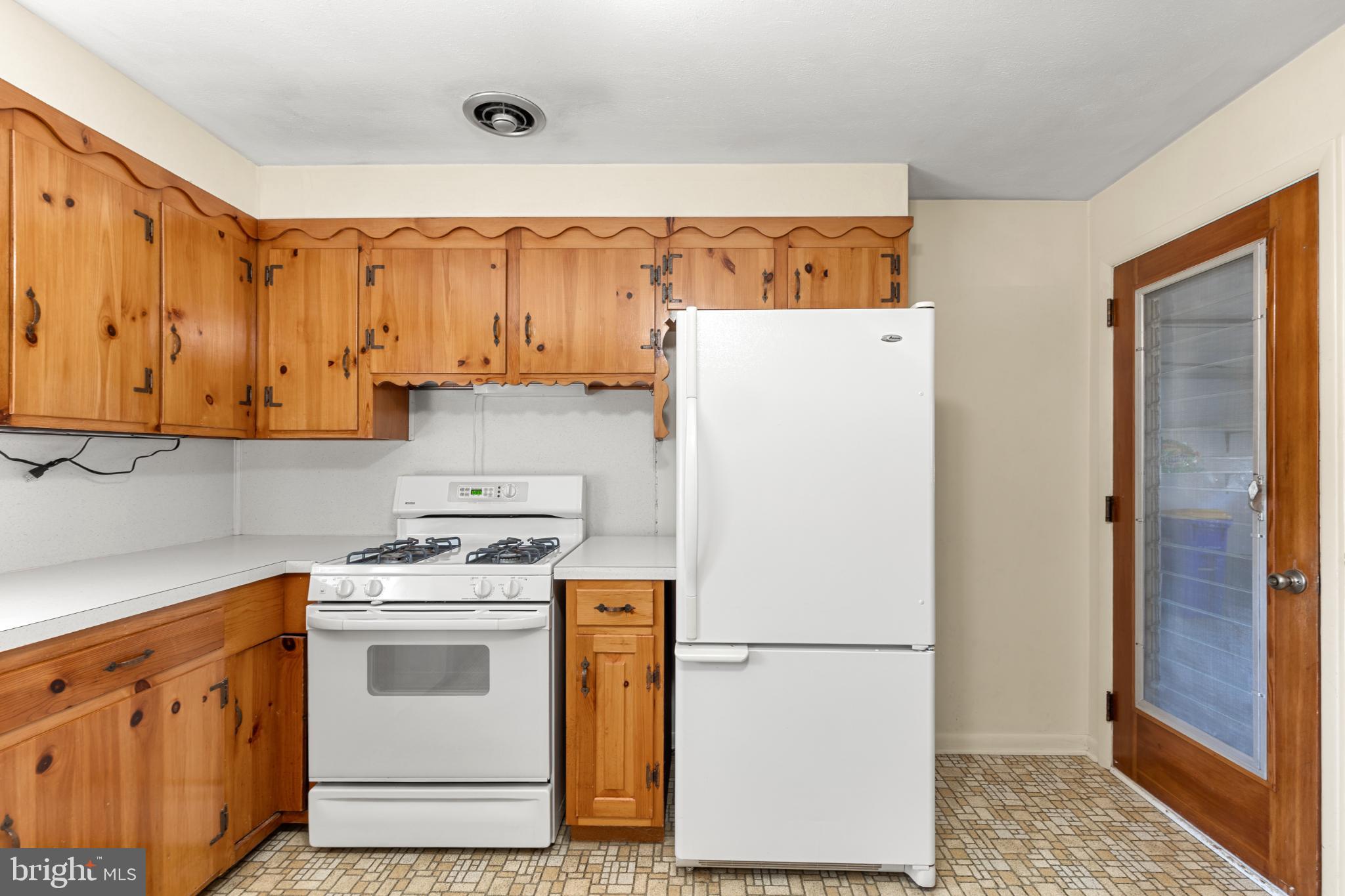1640 Church Road York, PA 17408 - Photo 8 of 26 a white refrigerator freezer sitting inside of a kitchen