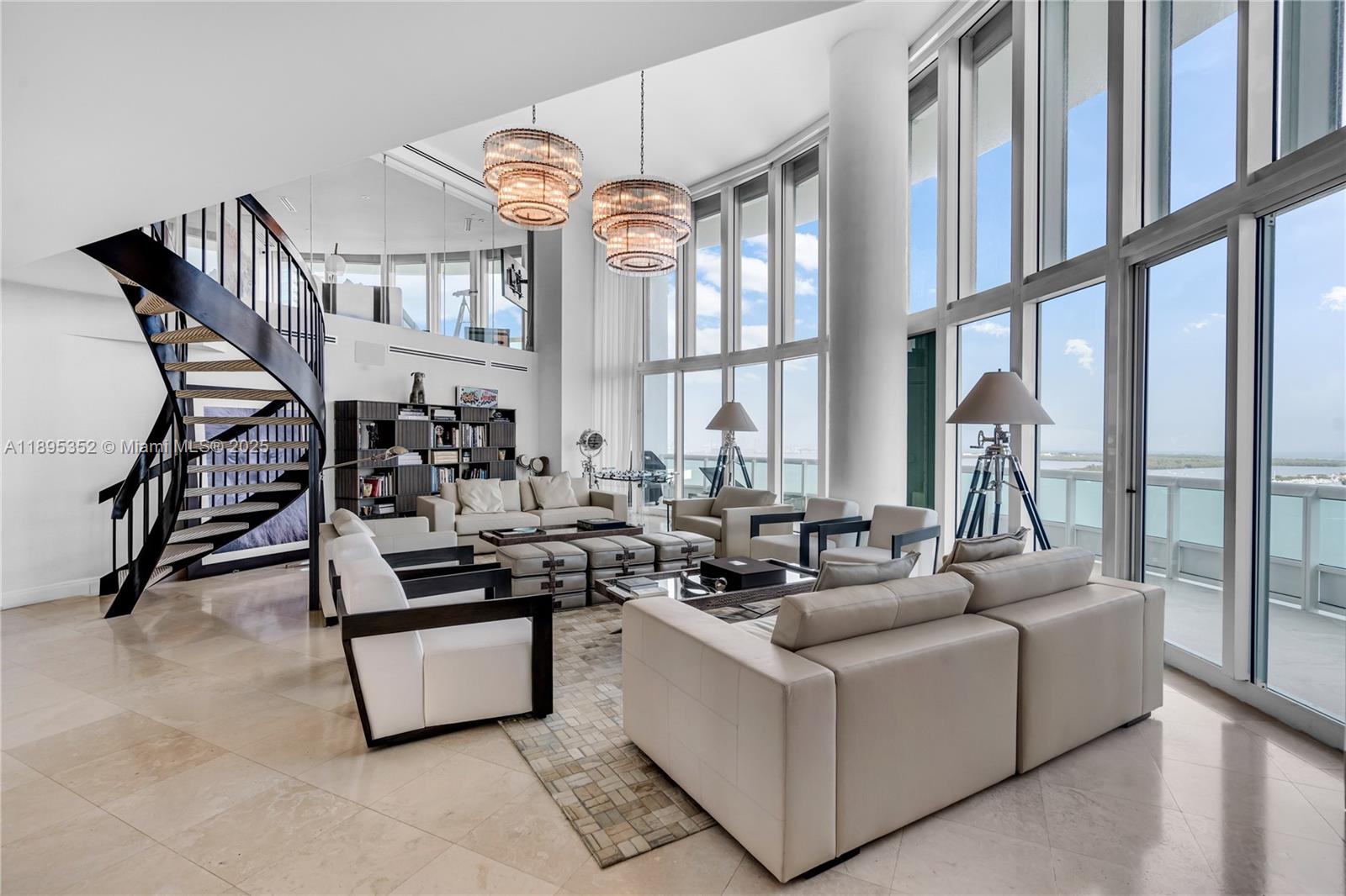 1643 Brickell Avenue, Unit 3501 Miami, FL 33129 - Photo 1 of 91 a living room with furniture a large window and a chandelier