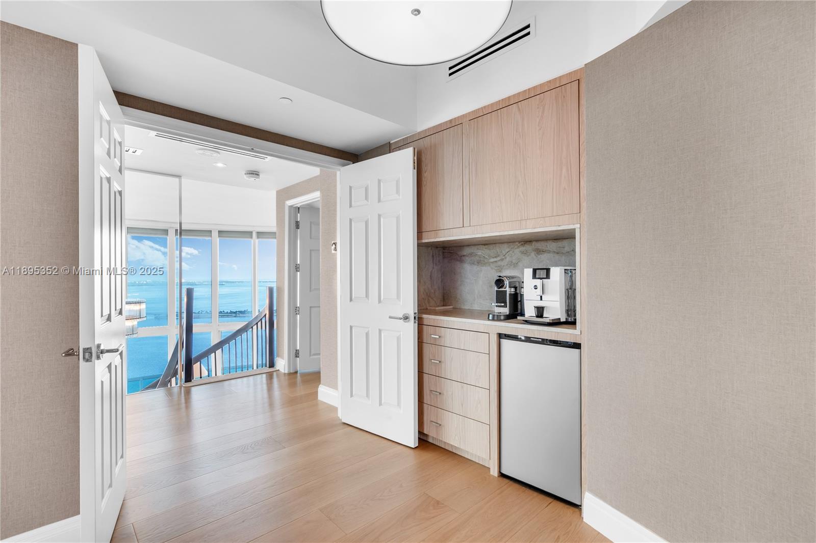 1643 Brickell Avenue, Unit 3501 Miami, FL 33129 - Photo 24 of 91 a view of a kitchen with a sink and a refrigerator