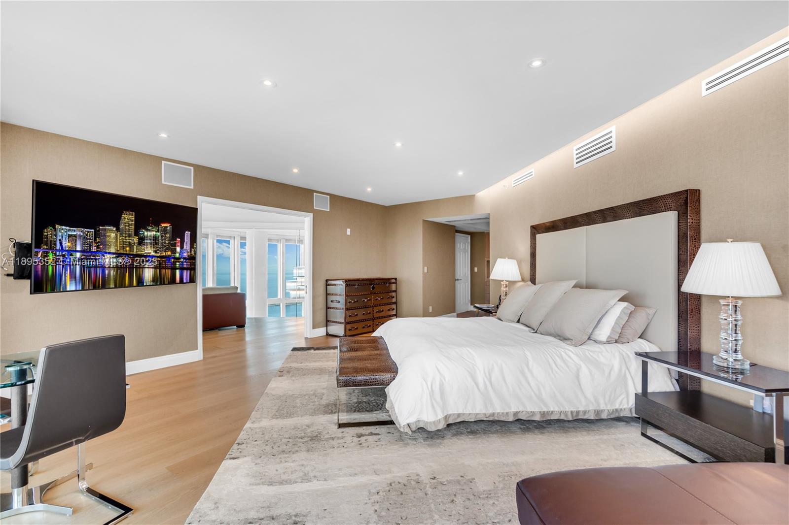 1643 Brickell Avenue, Unit 3501 Miami, FL 33129 - Photo 27 of 91 a bedroom with a large bed and a couch