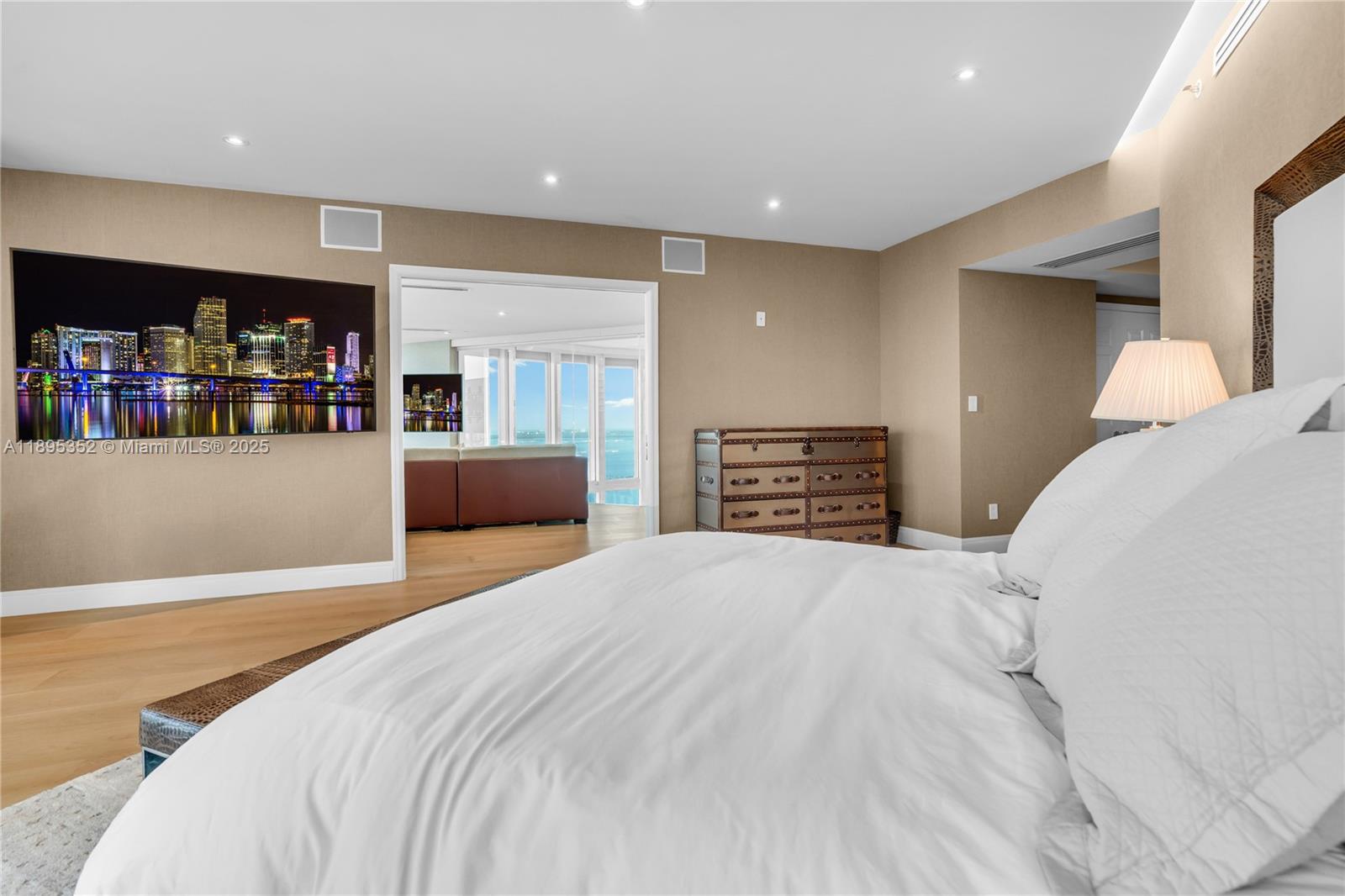 1643 Brickell Avenue, Unit 3501 Miami, FL 33129 - Photo 29 of 91 a bedroom with a bed and a book shelf