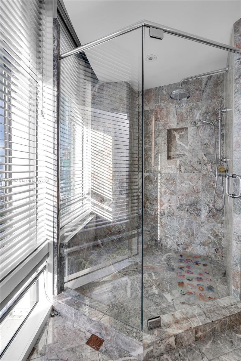 1643 Brickell Avenue, Unit 3501 Miami, FL 33129 - Photo 33 of 91 a bathroom with a shower and a window