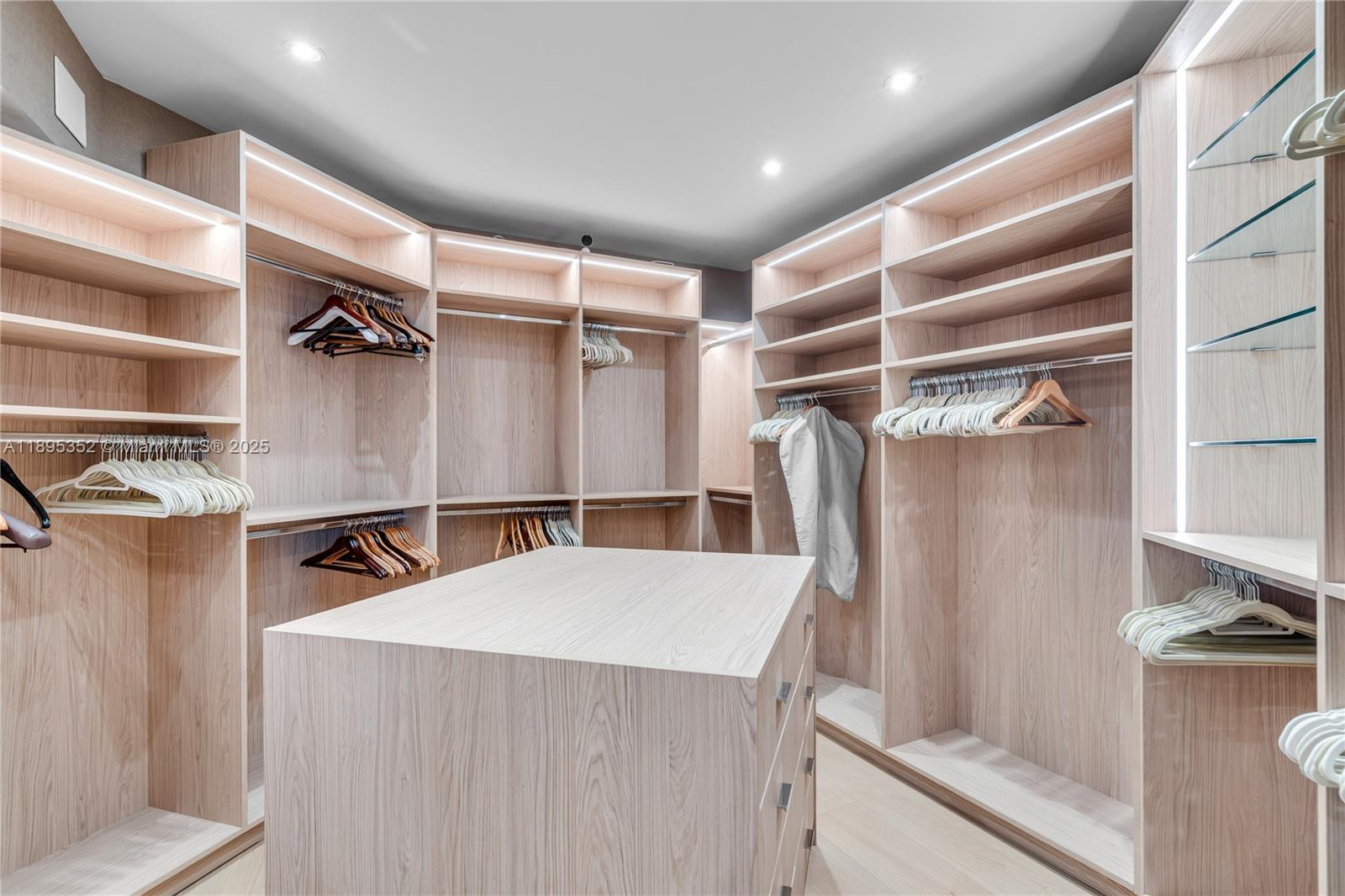 1643 Brickell Avenue, Unit 3501 Miami, FL 33129 - Photo 35 of 91 a view of walk in closet with clothes and shoes