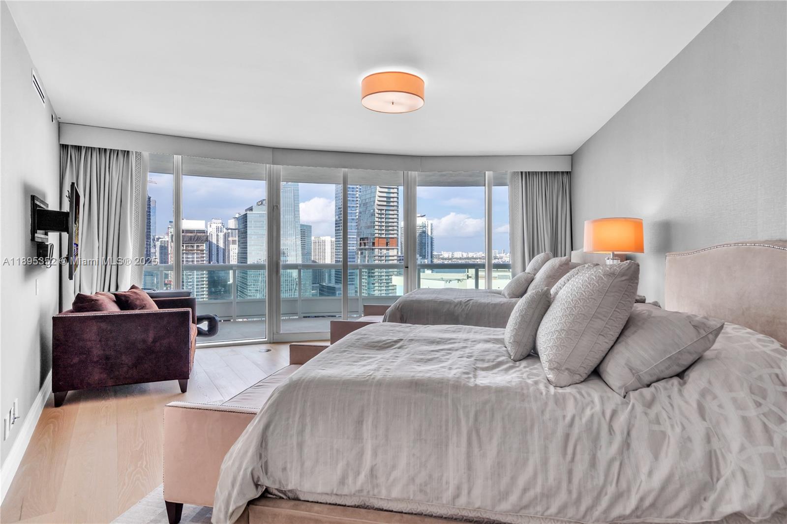 1643 Brickell Avenue, Unit 3501 Miami, FL 33129 - Photo 36 of 91 a bedroom with a bed and glass window