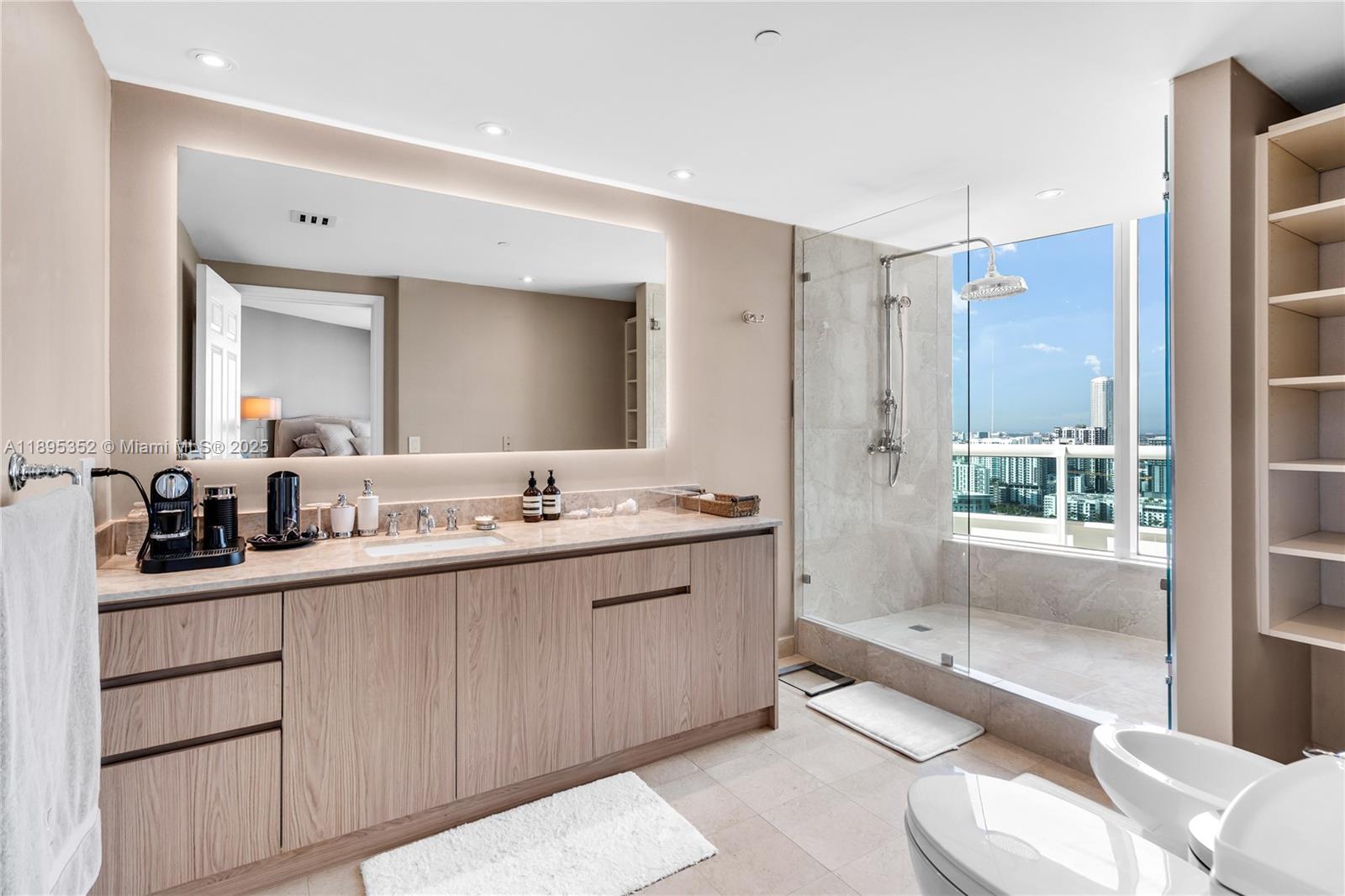1643 Brickell Avenue, Unit 3501 Miami, FL 33129 - Photo 37 of 91 a spacious bathroom with a double vanity sink toilet mirror and bathtub
