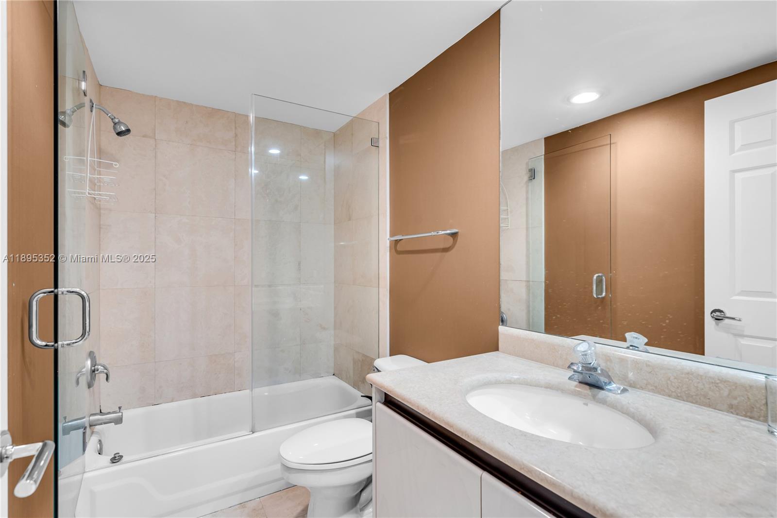 1643 Brickell Avenue, Unit 3501 Miami, FL 33129 - Photo 47 of 91 a bathroom with a granite countertop sink toilet and shower