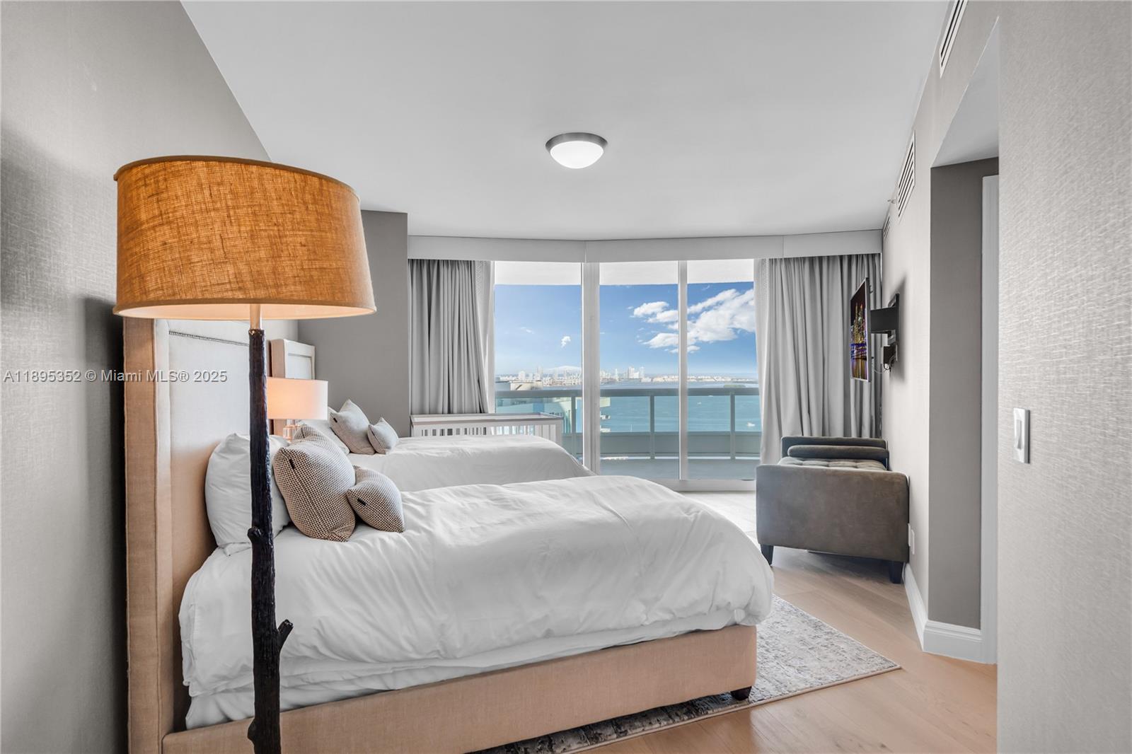 1643 Brickell Avenue, Unit 3501 Miami, FL 33129 - Photo 49 of 91 a bedroom with a bed and a window