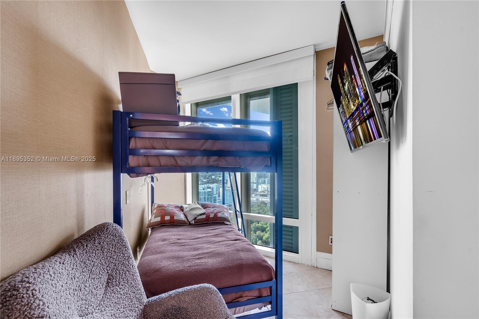 1643 Brickell Avenue, Unit 3501 Miami, FL 33129 - Photo 52 of 91 a bed room with a bed and a television