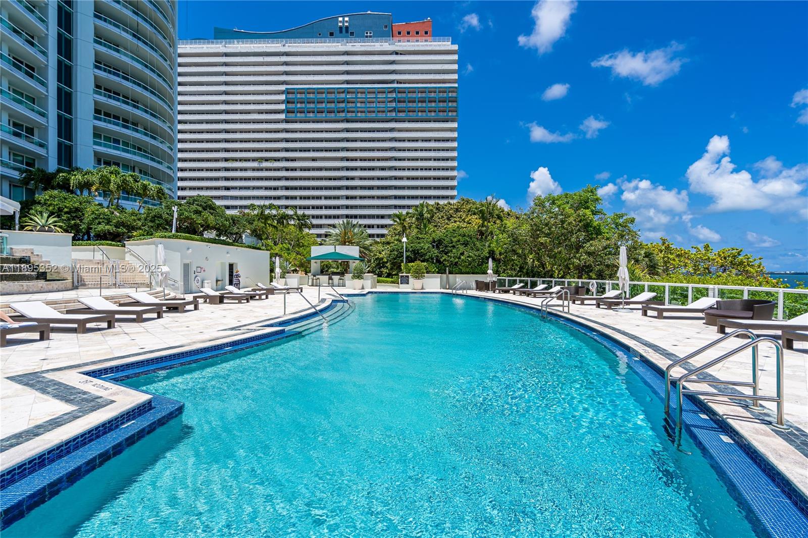 1643 Brickell Avenue, Unit 3501 Miami, FL 33129 - Photo 68 of 91 a swimming pool with outdoor seating and yard