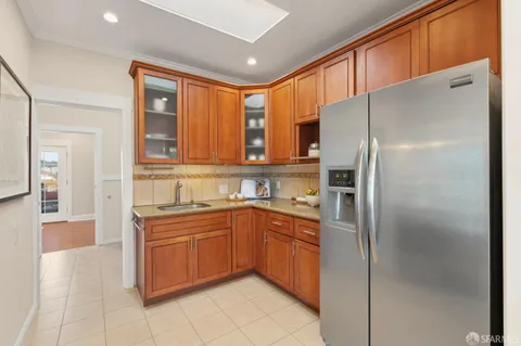 a kitchen with stainless steel appliances granite countertop a stove microwave and cabinets