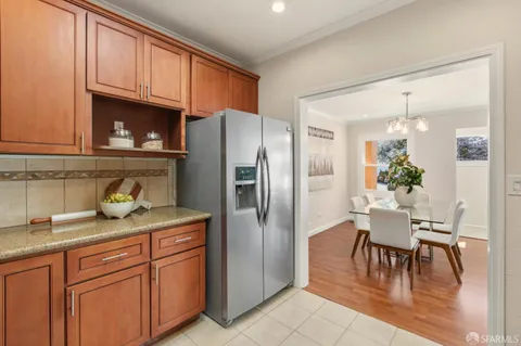 a bedroom with a large bed and a large window