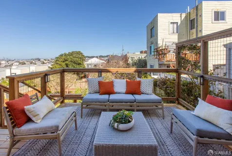 a bedroom with bed and a painting on the wall