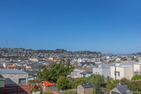 a view of a room that has a table and chair