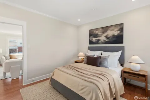 an aerial view of residential houses with a city view