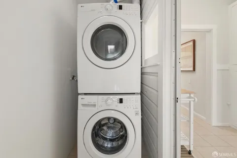 a view of a large white building with a city view