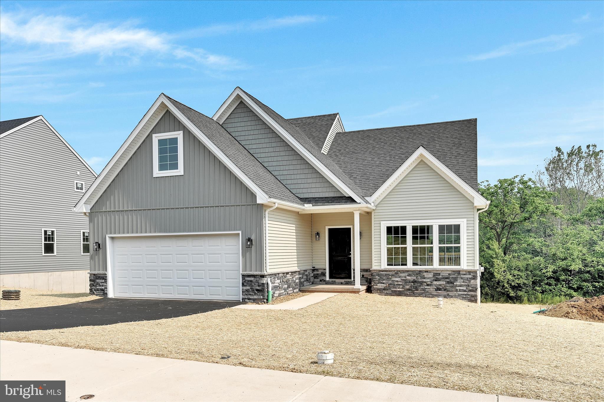 227 Pilgrim Drive Lancaster, PA 17603 - Photo 2 of 24 a front view of a house with a yard and garage