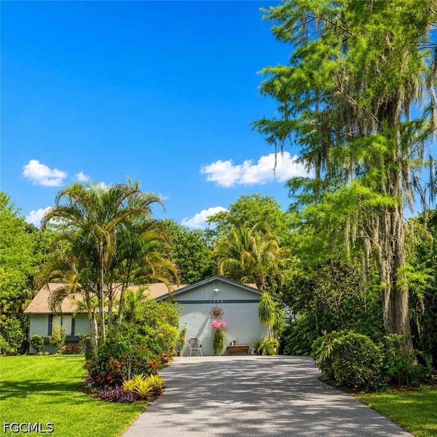 3534 White Boulevard Naples, FL 34117 - Photo 1 of 3 a front view of a house with a yard