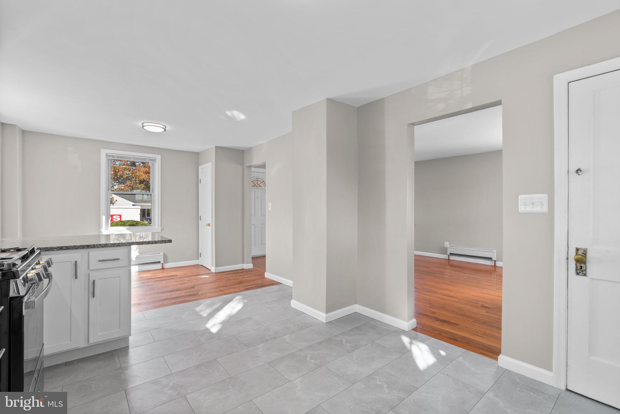8101 Hillendale Road Baltimore, MD 21234 - Photo 12 of 27 a view of livingroom with kitchen and hardwood