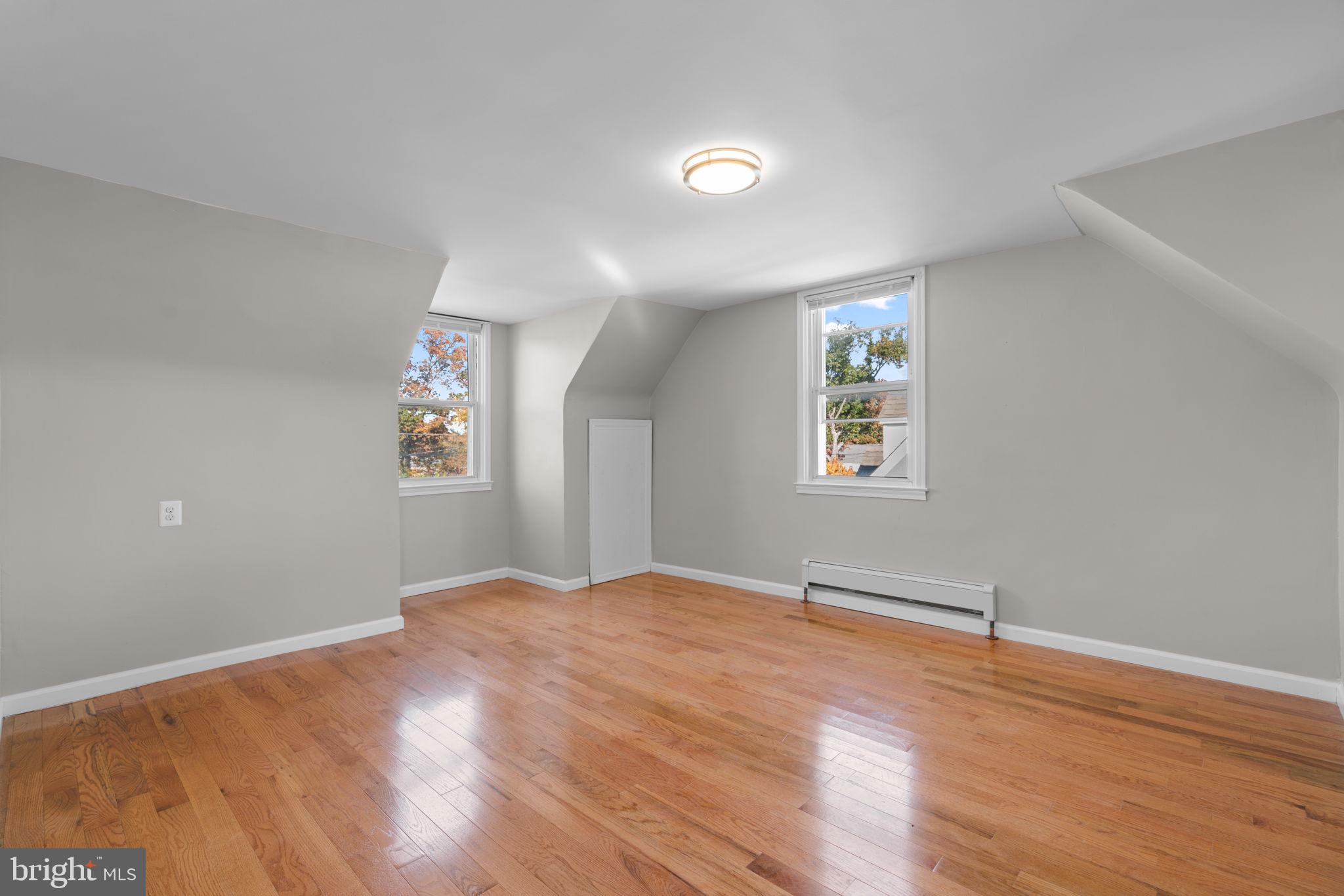 8101 Hillendale Road Baltimore, MD 21234 - Photo 15 of 27 a view of empty room with wooden floor and fan
