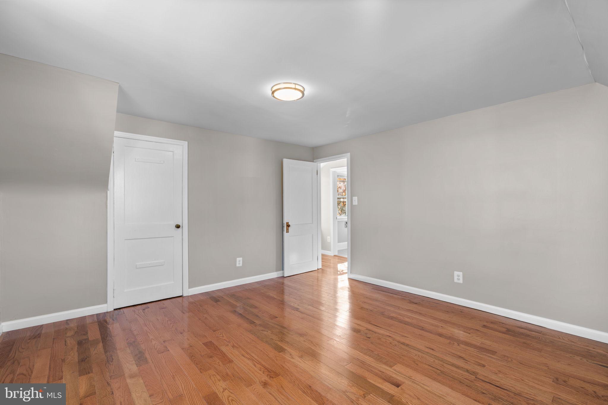 8101 Hillendale Road Baltimore, MD 21234 - Photo 17 of 27 a view of an empty room with wooden floor