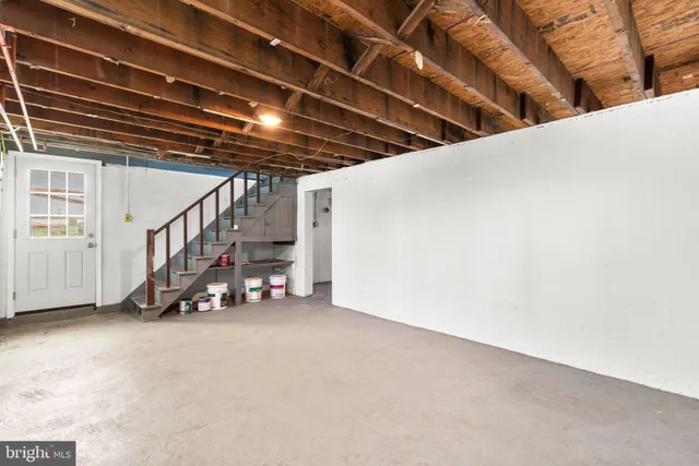 a view of an empty room with stairs