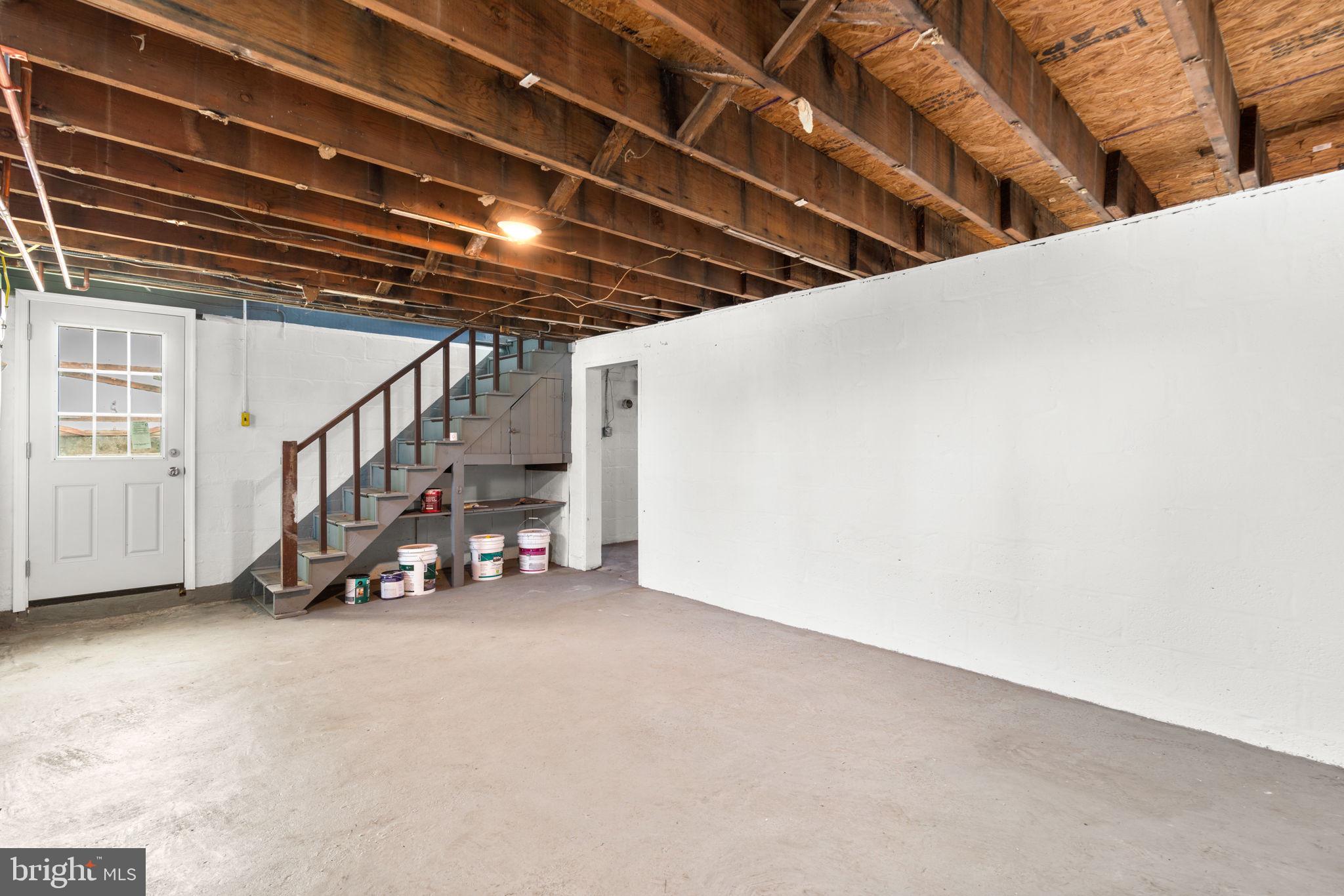 8101 Hillendale Road Baltimore, MD 21234 - Photo 21 of 27 a view of an empty room with stairs