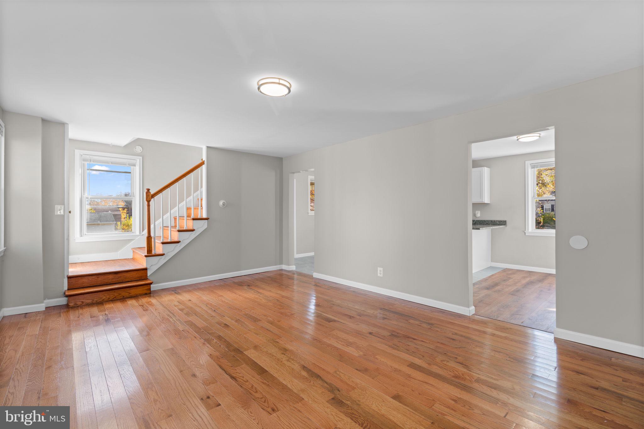 8101 Hillendale Road Baltimore, MD 21234 - Photo 5 of 27 wooden floor in an empty room with a window