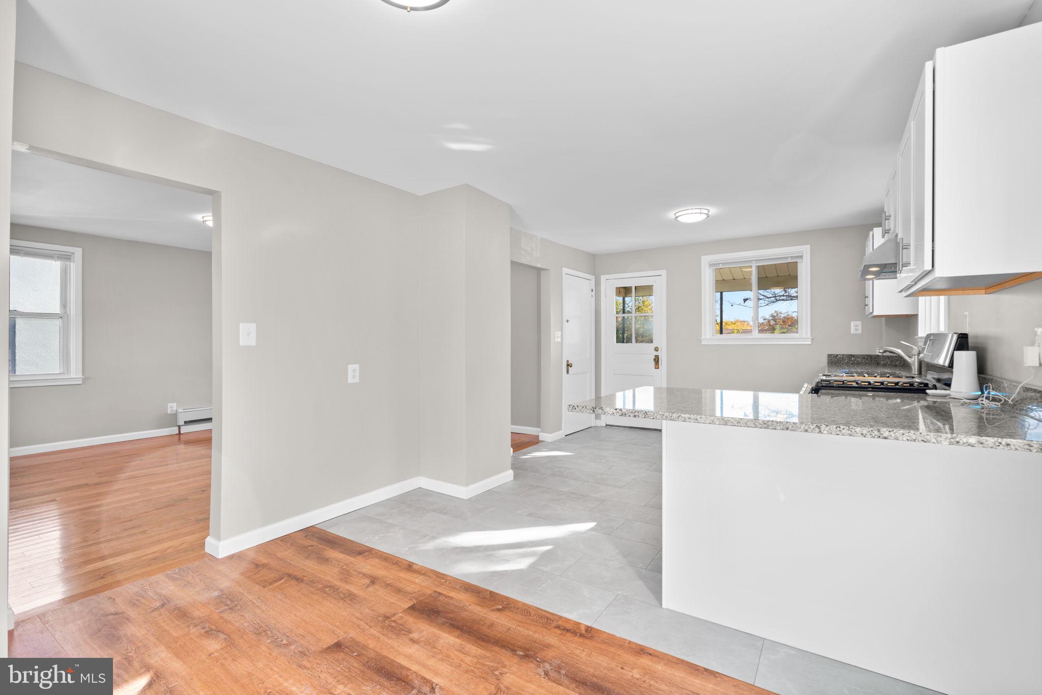 8101 Hillendale Road Baltimore, MD 21234 - Photo 8 of 27 a view of a kitchen with a sink microwave and cabinets