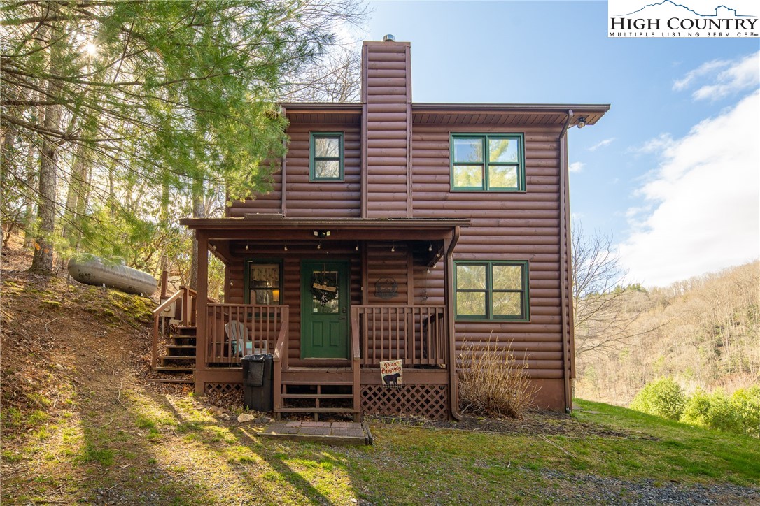 2408 Todd Railroad Grade Road Todd, NC 28684 - Photo 2 of 46 a front view of a house with garden