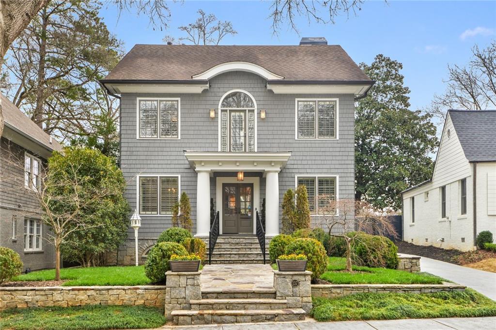 a front view of a house with garden