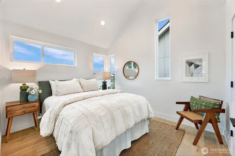 a bedroom with a bed and a table
