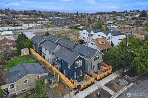 an aerial view of a house with a city view