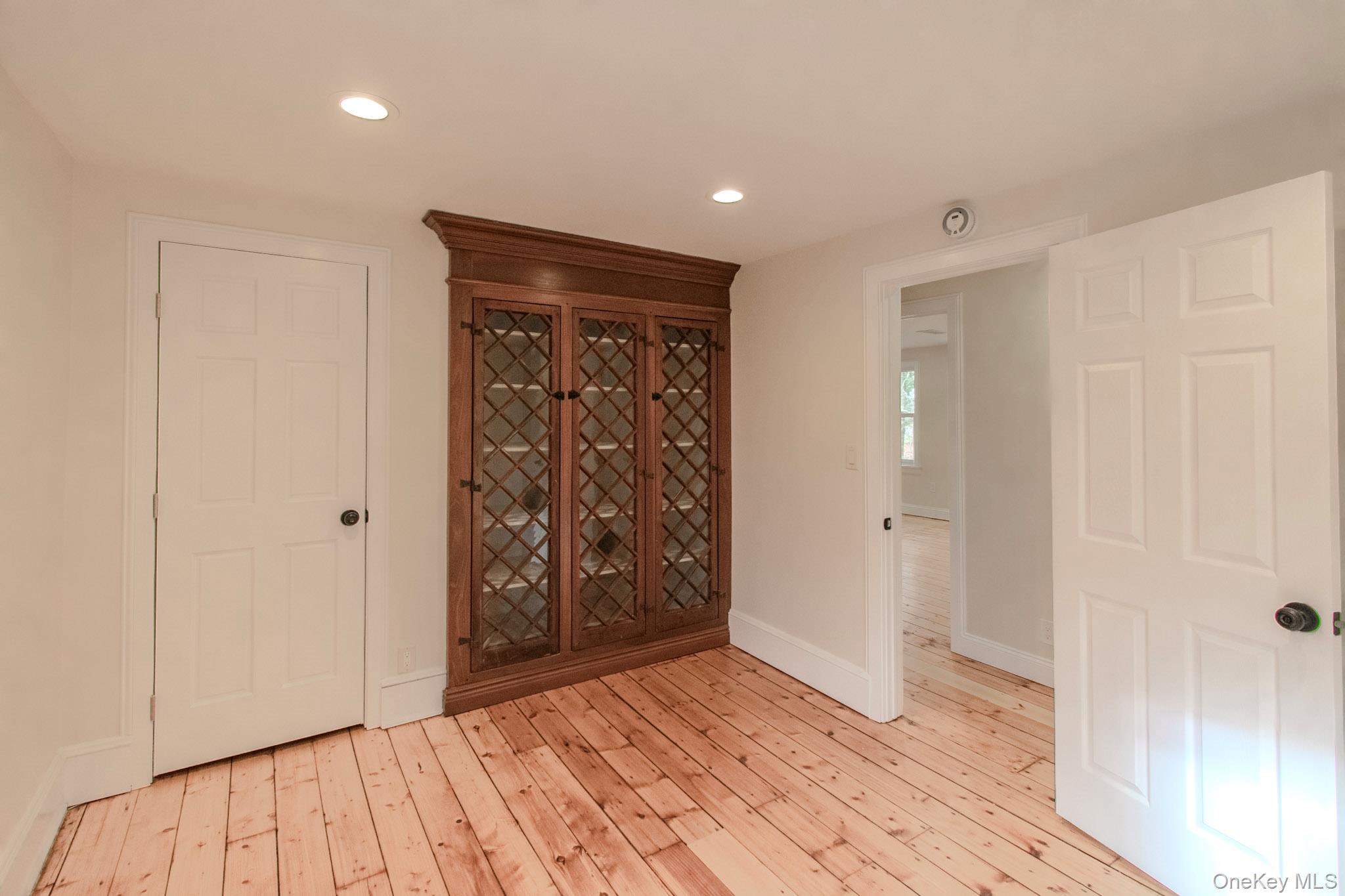 54 East Lake Stable Road Tuxedo Park, NY 10987 - Photo 24 of 31 Wine area featuring light wood-type flooring